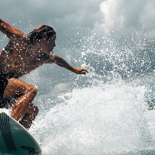 Surfing a big wave.