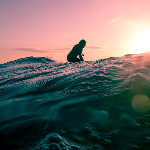 Waiting for the right wave on a surf board.